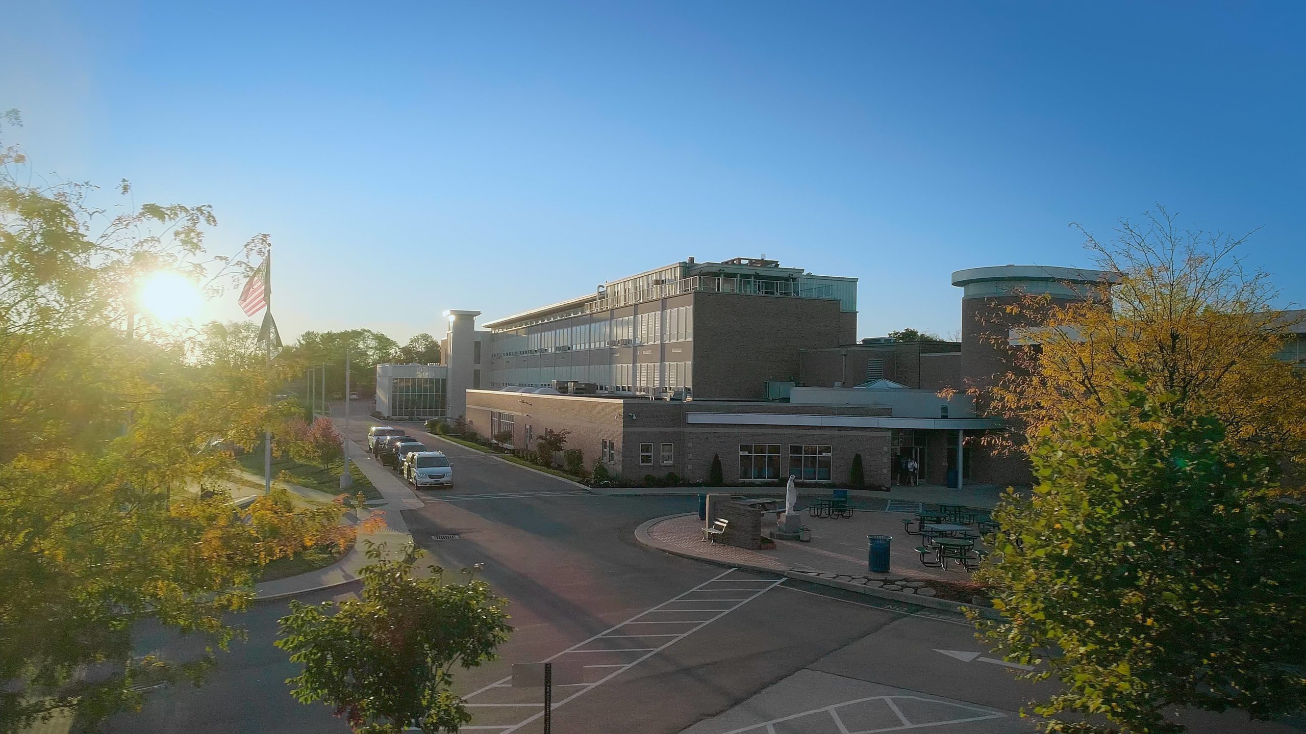 View of Notre Dame Academy catholic all girls school in Northern Kentucky with the sun setting in the background.