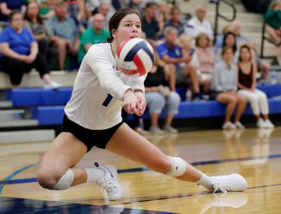 A volleyball player diving for a ball at the Notre Dame Academy catholic all-girls school in Covington, Northern Kentucky.