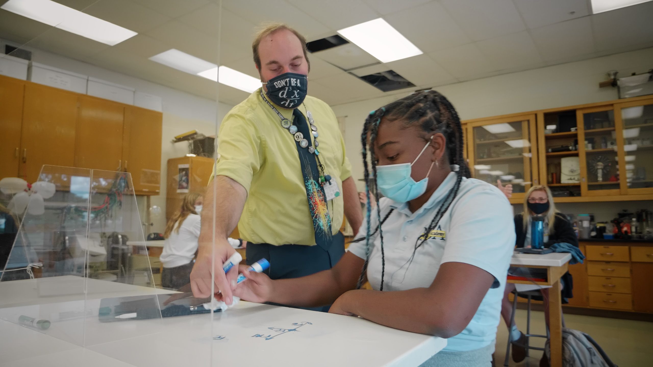 A teacher helping a student with their Match class work at Notre Dame Academy catholic all-girls school in Covington, Northern Kentucky.