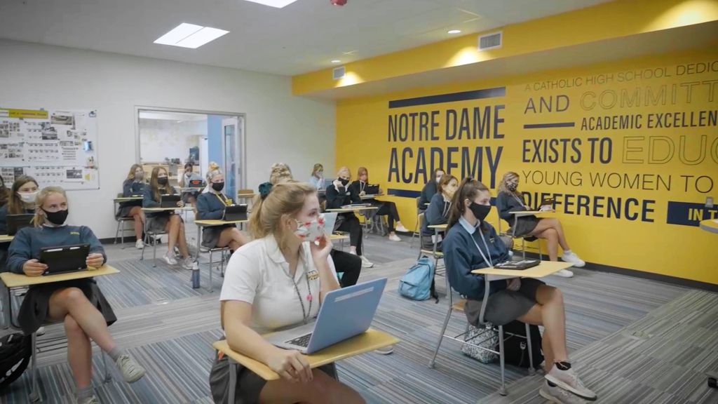 Students sitting socially distant at their desks in the classroom at the Notre Dame Academy catholic all-girls school in Covington, Northern Kentucky.