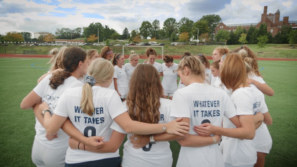 The soccer team huddled together during a timeout at a match at the Notre Dame Academy catholic all-girls school in Covington, Northern Kentucky.